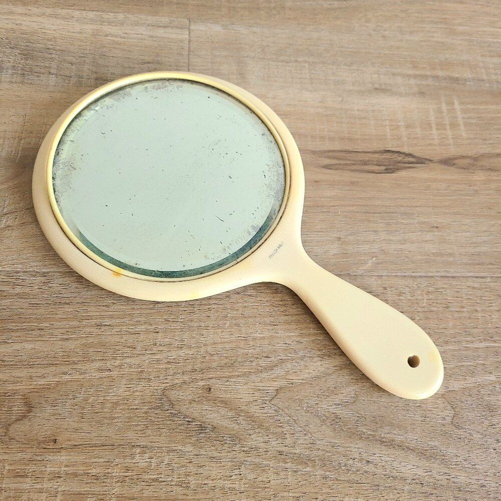 Antique French Ivory celluloid hand mirror.